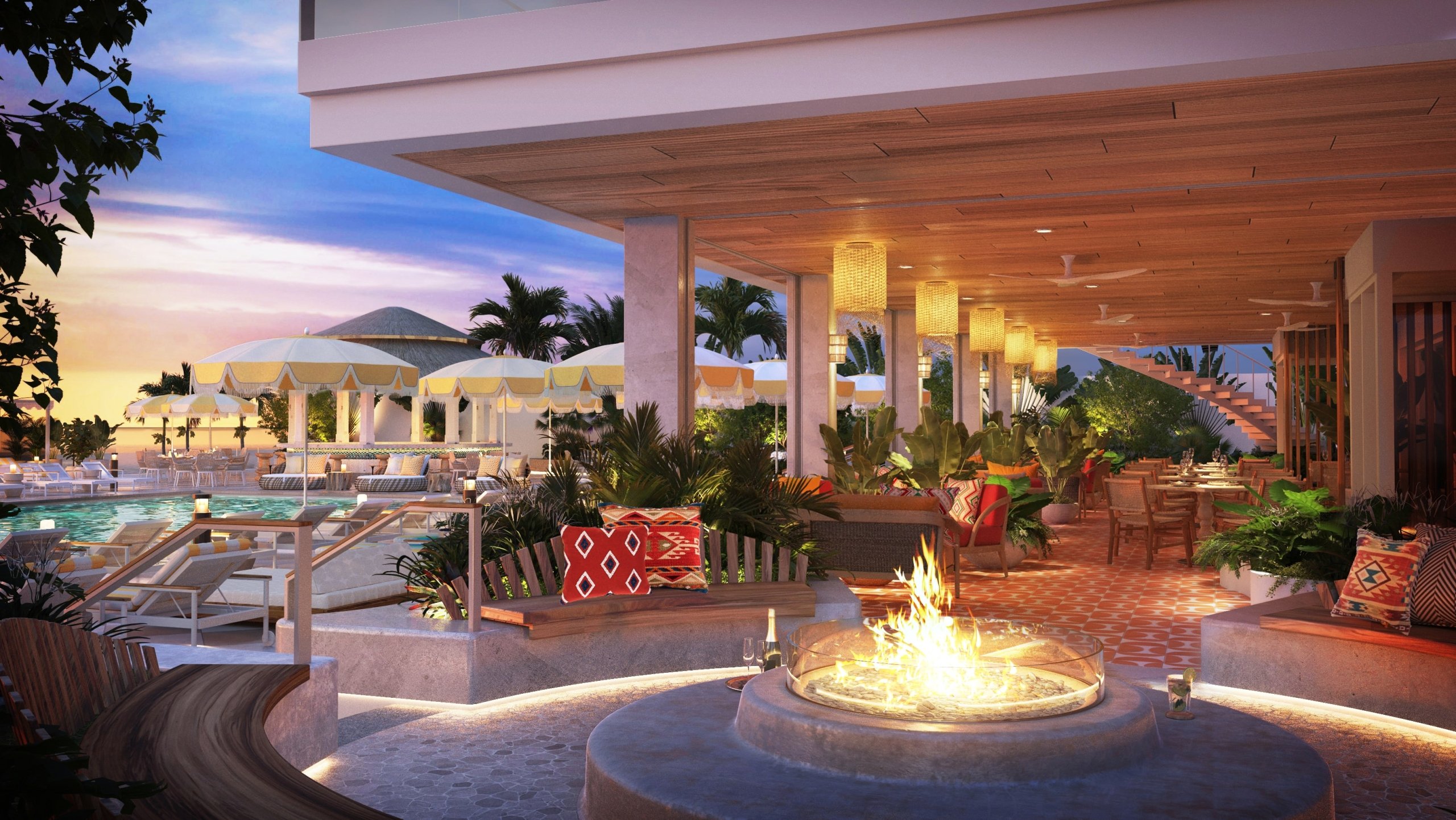 Dining terrace with fire pit and pool in the background