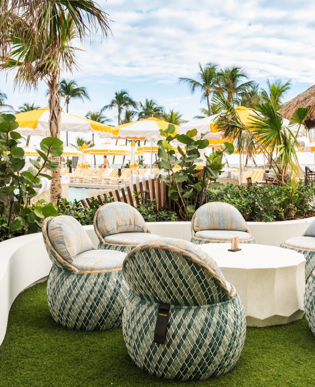 Chairs arranged around a table by pool