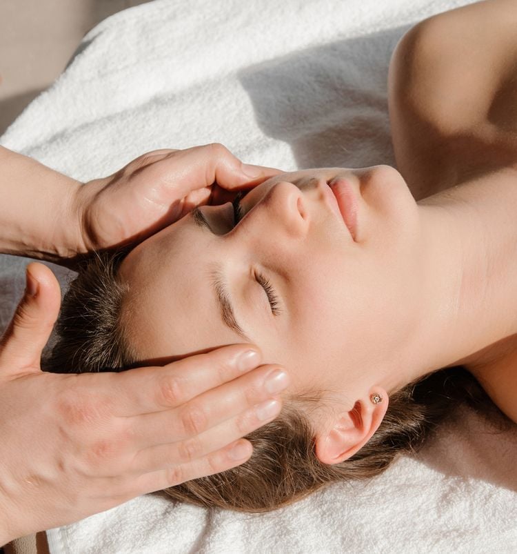 woman enjoying a facial at The Sunny Spa