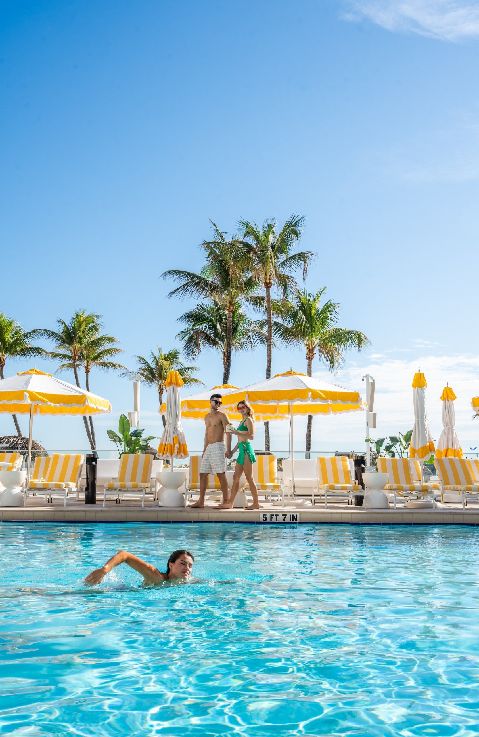 guests enjoying the outdoor pool at The Sunny