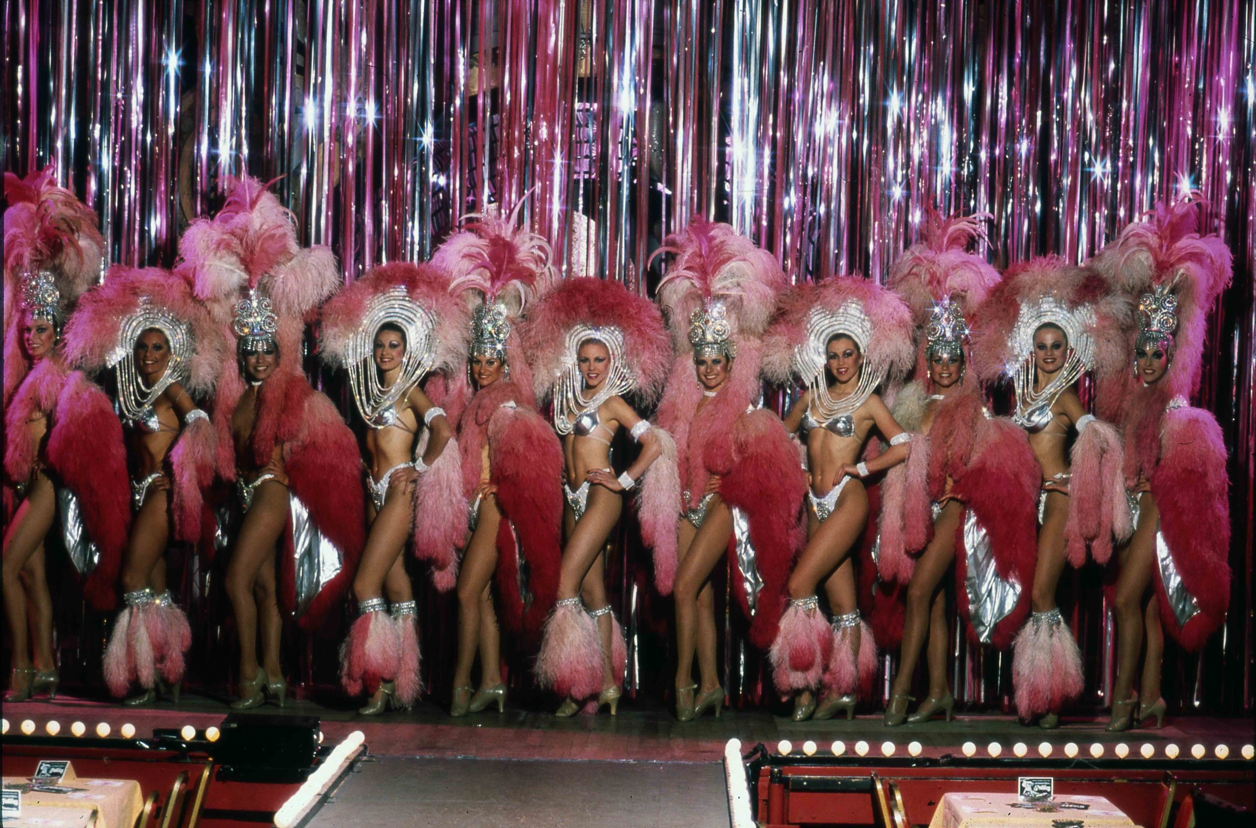Woman wearing pink custom on a stage