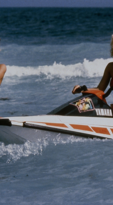 Three women jet skiing - Newport Beachside Vintage Photo