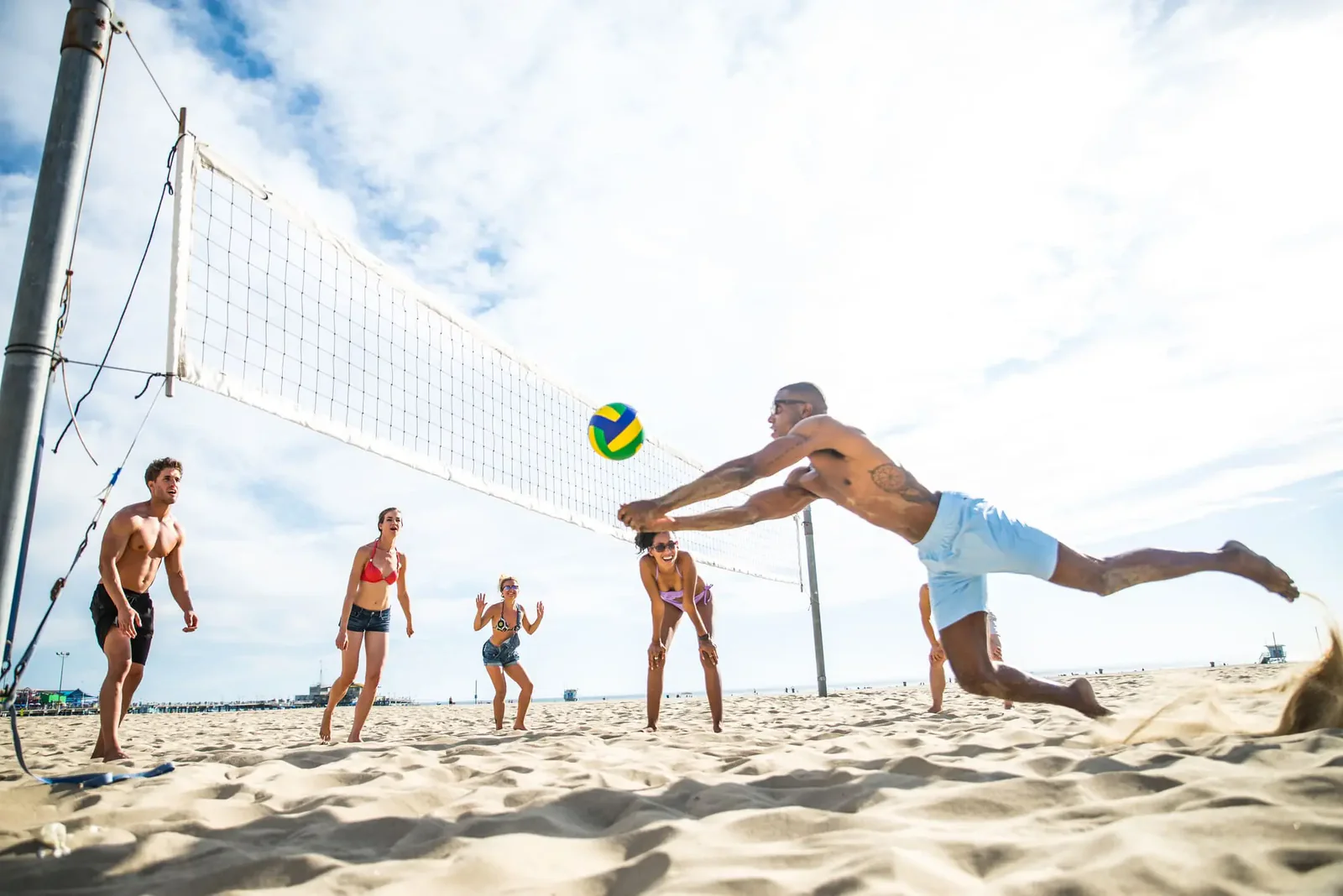 People playing volleyball in sunny weather