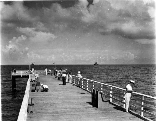 People on a bridge at Newport Fishing Pier
