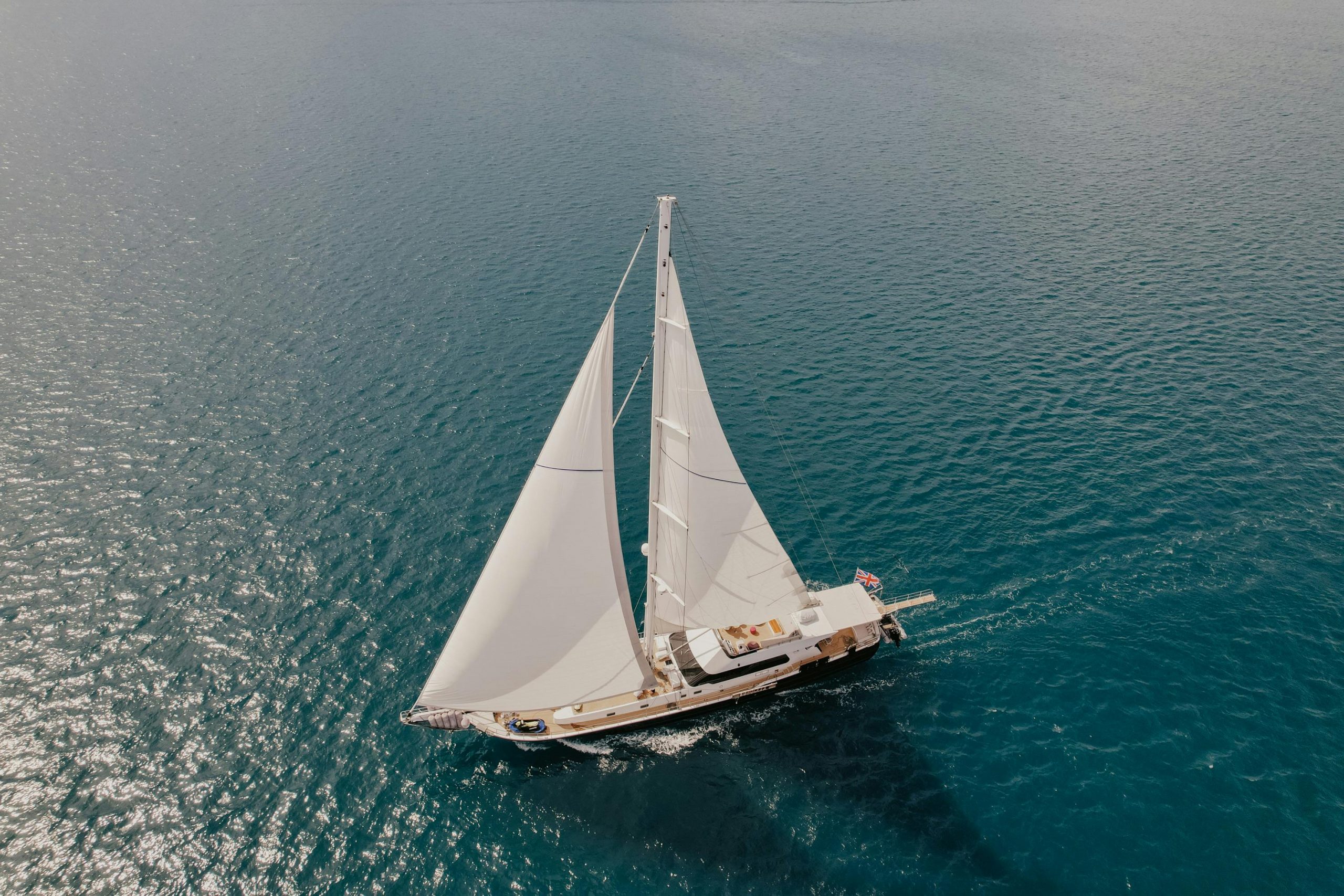 A white yacht with English flag