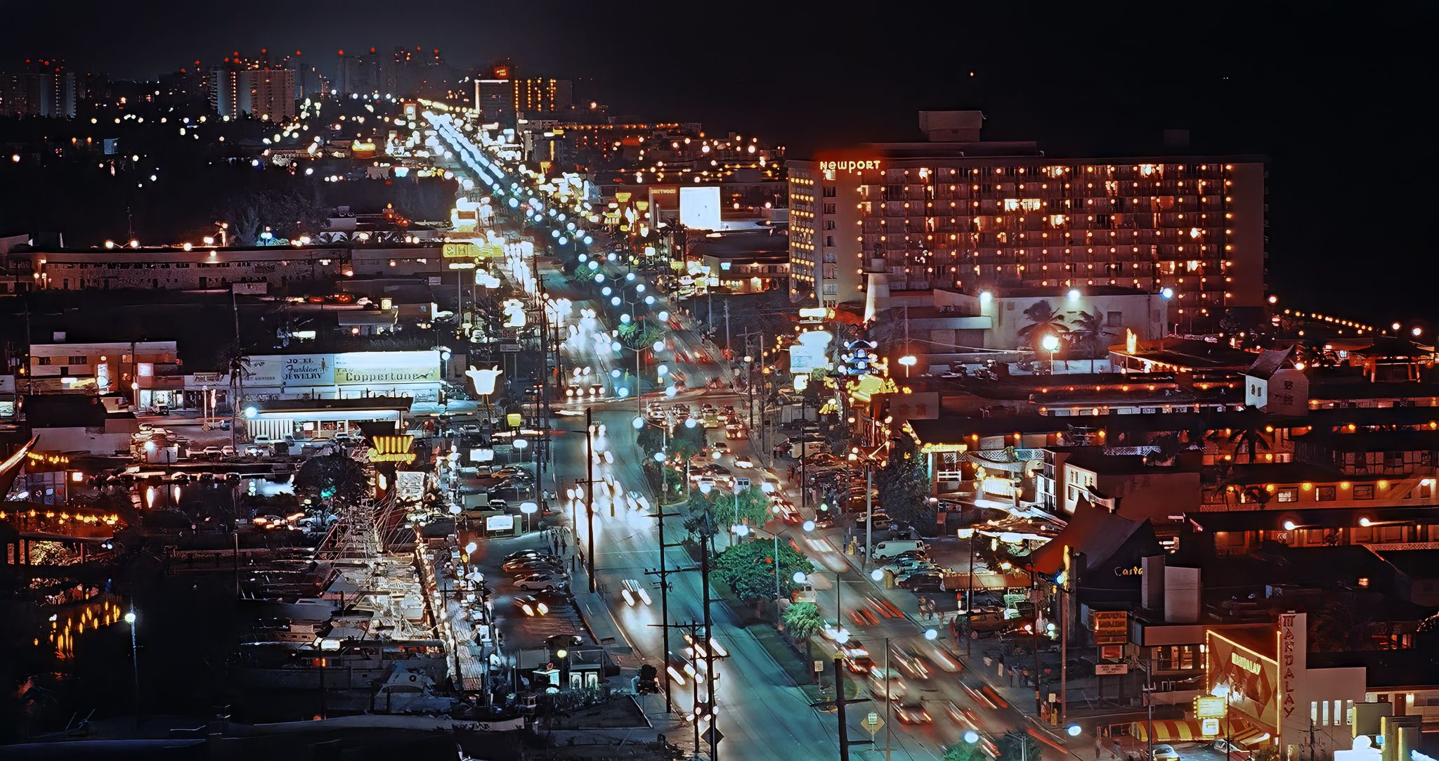 Old Newport hotel and Motel Row along with Sunny Isles Beach at night