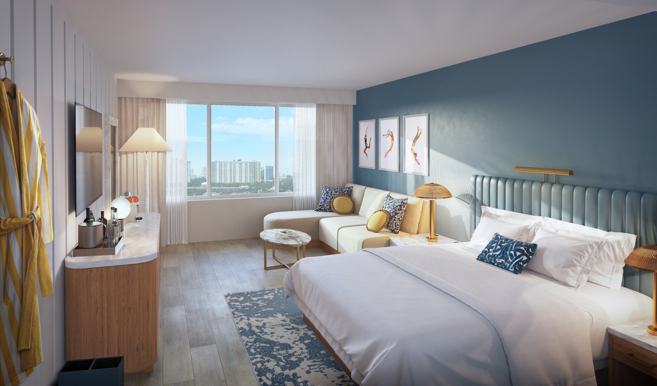 A large room with a couch and a bed with city view window from City VIew King Room