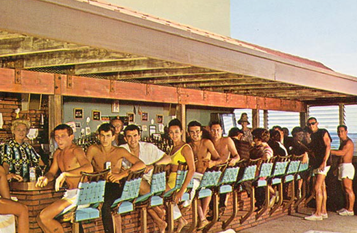 People with blue stool chairs near a bar table