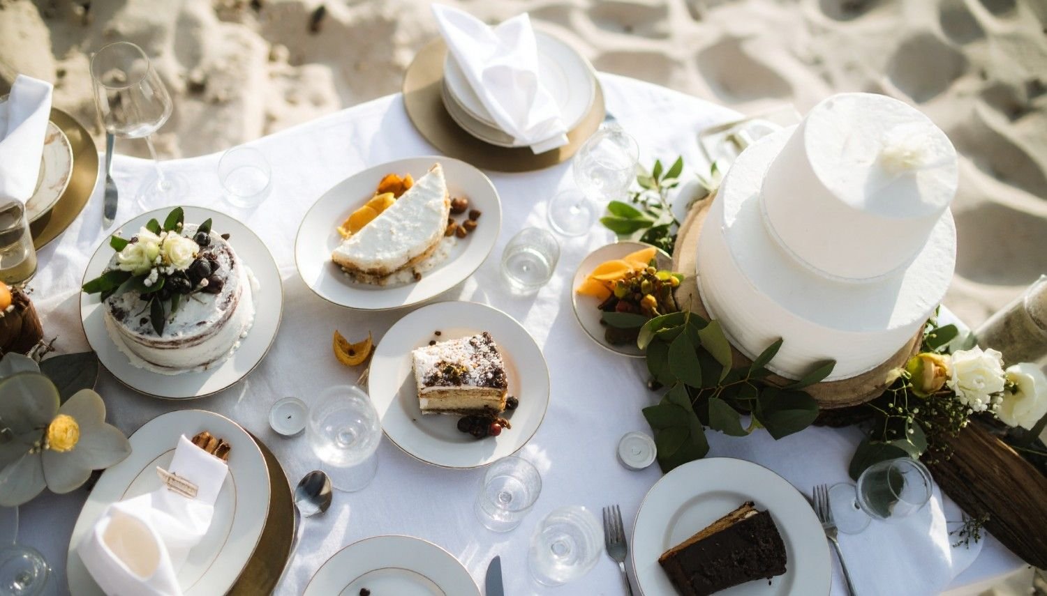 Wedding cake on a table set up on the beach
