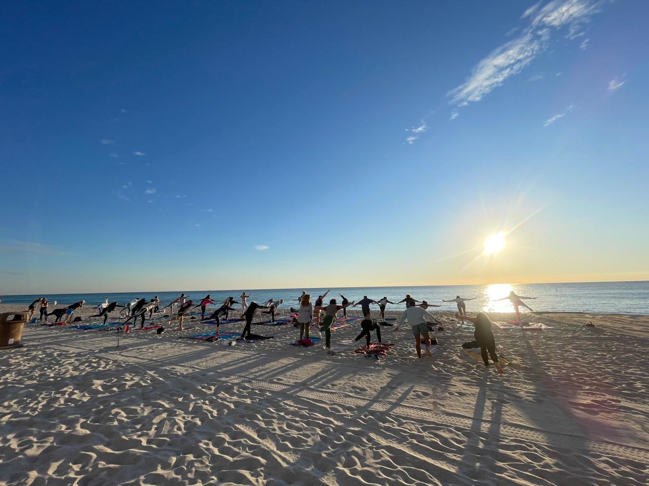Sunrise Yoga on the beach The Sunny Athletics Claudia Vasconcelos